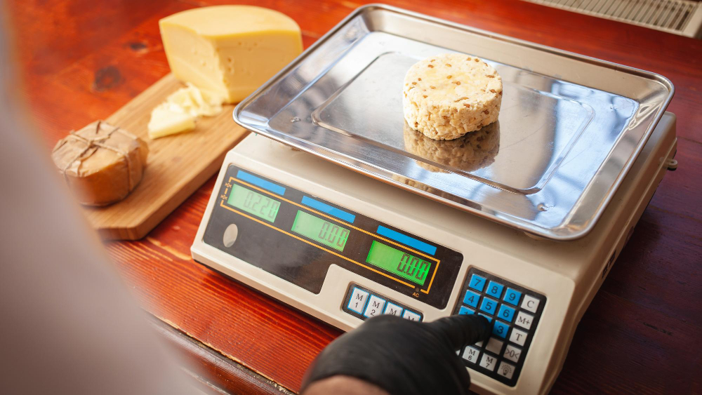 Digital Weighing Scale Measuring Fresh Cheese